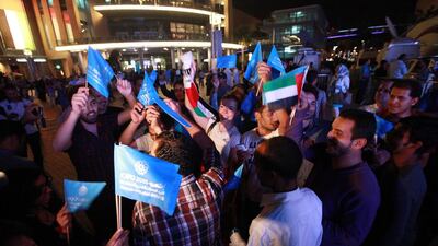 Dubai is targeting to attract 20 million visitors by 2020. Above, people celebrate after Dubai won the bid to host the World Expo 2020. Ali Haider / EPA
