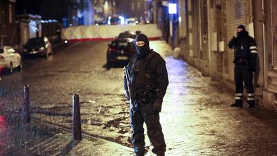 Policemen stand guard in Verviers on January 15, 2015, after two men were killed during an anti-terrorist operation in the east Belgian town. Bruno Fahy/Belga Photo/AFP Photo