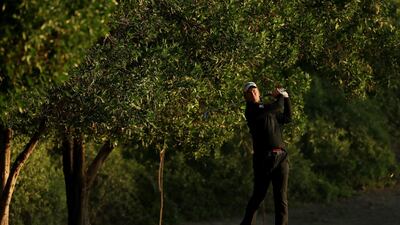 Robert Karlsson of Sweden plays his second shot on the tenth hole. Andrew Redington / Getty Images