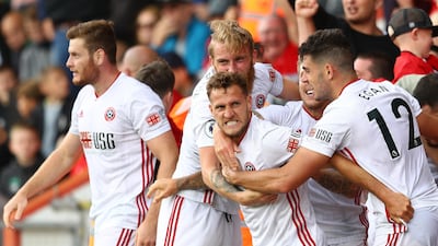 Billy Sharp of Sheffield United celebrates with teammates after scoring in the Premier League match against Bournemouth at Vitality Stadium on August 10, 2019 in Bournemouth. Getty Images
