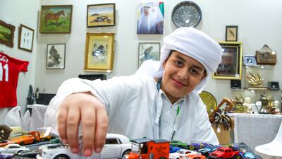 Ahmed Mansour at his father's UK Antiques Events stall at Adihex. Victor Besa / The National