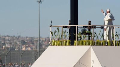 Pope Francis gives his blessing after a prayer along the bank of the Rio Grande River in Ciudad Juarez, Mexico. L' Osservatore Romano / Pool photo via AP