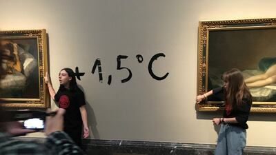 Climate protesters from Extinction Rebellion stick themselves to the frames of Goya paintings. Reuters