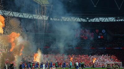 The teams walk out ahead of the FA Community Shield football match between Arsenal and Chelsea at Wembley Stadium in north London on August 2, 2015. AFP PHOTO / GLYN KIRK