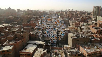 eL Seed’s Perception, created in the Zabaleen district of Cairo, Egypt, can only be viewed in its entirety from a single vantage point. Courtesy eL Seed