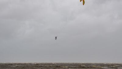 A kite-surfer practices in Chatelaillon-plage during Miguel storm. AFP