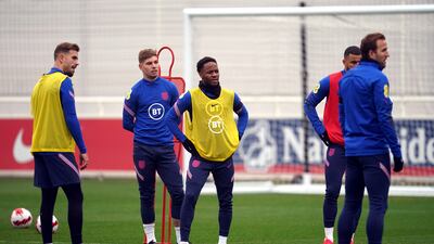 England's Emile Smith Rowe, centre, and Raheem Sterling train on Thursday. PA