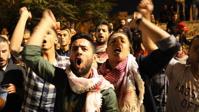 Activists shout slogans against the newly proposed income tax reforms and hike in petrol prices. Andre Pain / EPA