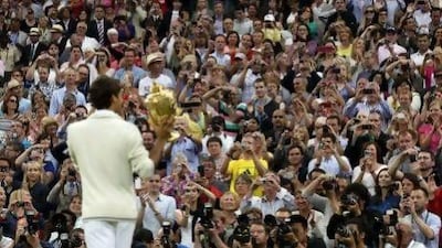 Roger Federer got his hands on a seventh Wimbledon trophy, equal with his idol Pete Sampras.