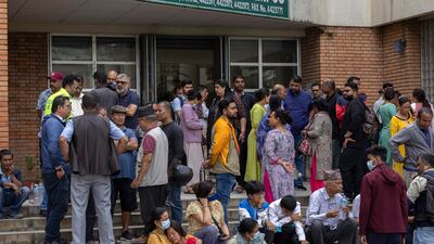Relatives of crash victims gather outside the hospital mortuary. EPA