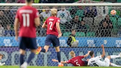Slovenia forward Andraz Sporar scores the equalising goal against Norway. AP