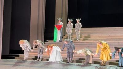 Cast member Daniel Perry holds the Palestinian flag during the curtain call of Il Trovatore at Royal Opera House in London. Reuters