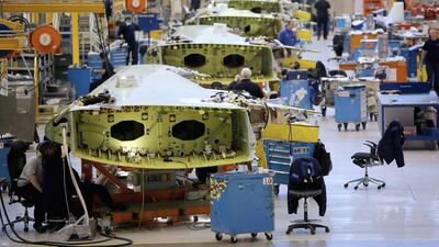 Technicians work on the wing of an Airbus A320 at the Airbus factory in Broughton, United Kingdom. The facility produces over 1,000 wings a year and employs more than 6,000 people. Christopher Furlong / Getty Images