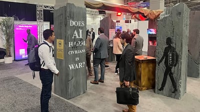 The Red Cross booth at the AI+ convention in Washington, surrounded by the stalls of defence contractors and technology giants. Photo: Cody Combs