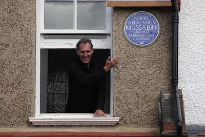 A blue plaque commemorating the life of athletics coach Scipio Africanus Mussabini is unveiled by actor Ben Cross in London in 2012. Getty Images
