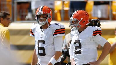 Johnny Manziel, right, will have to wait his turn. The Cleveland Browns have decided their best chance to reach the play-offs is with Brian Hoyer , left, who has been their starting quarterback up to this point in the season. Gregory Shamus / AFP
