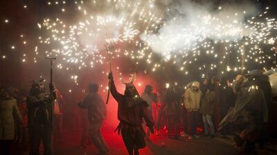 A reveller wearing a demon costume takes part in the traditional festival of “Correfoc” in Palma de Mallorca. Jaime Reina / AFP