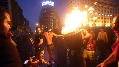 Demonstrators clash with riot police during a second day of protests in Beirut on August 23, 2015. AFP