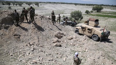 Afghan security officials patrol during an operation against militants in Nangarhar province on Sunday. EPA
