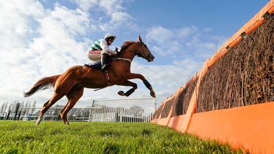 Jockey Jamie Moore guides Nassalam clear of the last fnece to win the One More For The Moore's Juvenile Hurdle at Fontwell Park Racecourse, in England, on Tuesday, December 8. PA