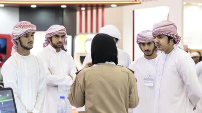Students at the Armed Forces stall at the National Career Exhibition at Sharjah Expo Centre. Reem Mohammed / The National
