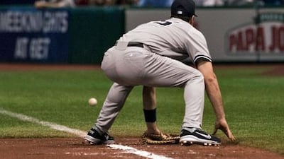 New York Yankees first baseman Mark Teixeira misses a ground ball hit by Tampa Bay Rays' Elliot Johnson that gave Tampa Bay victory.