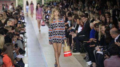 There were sequins, there were fringes, and there were, of course, purses. Tory Burch’s spring collection was an eclectic mix of bold patterns and looks that could morph from a day wedding to a cocktail party to the red carpet. Among the key looks: A shirt minidress with colour blocks of red, black, blue and orange; cream trousers with dark tree prints with a dark-blue solid waist stripe; black-and-white patterned cotton shorts with a fringe; an ankle-long taupe dress accented by metallic designs; and trousers with blue, black and cream vertical stripes and tuxedo-like black stripes running down the side. The fabrics were varied too, from knits and cottons to canvas and linens. Joshua Lott / AFP