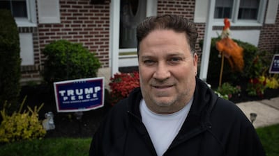 Scott Brady stands in front of his house with a Trump campaign sign in Springfield, Pa. Once a Democrat, Brady says he switched parties to vote for Donald Trump in 2016, and plans to vote for him again in 2020. AP Photo