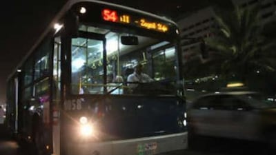The no 54 night bus stops for passengers on its way to Abu Dhabi mall.