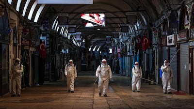 Employees disinfect streets and shops inside Istanbul's famous Grand Bazaar to prevent the spread of coronavirus. EPA