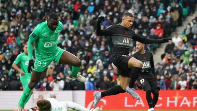 Saint-Etienne goalkeeper Etienne Green saves from PSG's Kylian Mbappe. AP