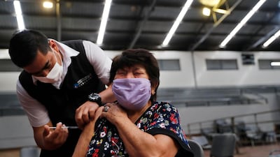 Braulia Amarilla, 75, being injected with a dose of the AstraZeneca vaccine in Asuncion, Paraguay. AP Photo