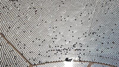 The 300,000 computer-controlled mirrors reflect sunlight to boilers that sit on 459-foot towers. The sun’s power is used to heat water in the boilers’ tubes and make steam, which in turn drives turbines to create electricity. Ethan Miller / Getty Images / AFP