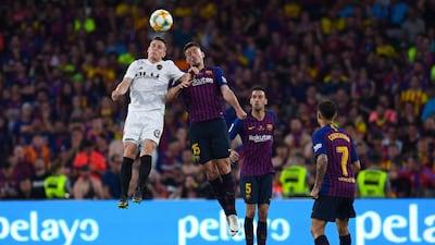 Valencia's Kevin Gameiro competes for the ball with Clement Lenglet. Getty