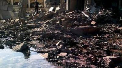 A Syrian man stands in rubble at the scene of a car bomb attack in Qamishli, 800 kilometres northeast of Damascus. The bombing is the latest sign that Syria’s largest ethnic minority is increasingly being drawn into the widening civil war.