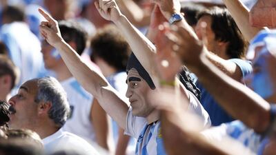 A fan of Argentina wearing a mask of retired Argentine player Diego Maradona cheers before their 2014 World Cup match against Switzerland on Tuesday in Sao Paulo, Brazil. Ivan Alvarado / Reuters