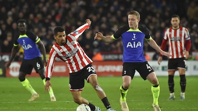 Sheffield United's Iliman Ndiaye, left, and Tottenham's Oliver Skipp vie for the ball. AP Photo