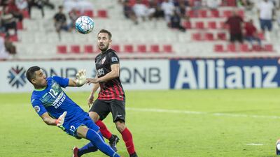 Everton Ribeiro, right, scores Al Ahli's fourth goal in a 4-0 win over Lokomotiv at Rashid Stadium in Dubai. Antonie Robertson / The National