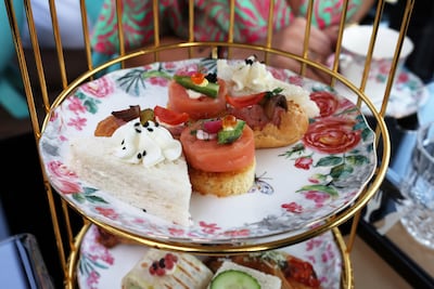 Sandwiches and wraps are served during the afternoon tea experience on a BusTronomy. Pawan Singh / The National
