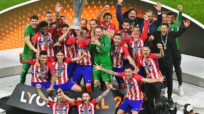 Atletico Madrid players celebrate with the trophy after winning the UEFA Europa League final between Olympique Marseille and Atletico Madrid in Lyon, France, on May 16, 2018. Atletico won 3-0. Sascha Steinbach / EPA
