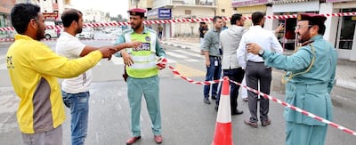 Police asked residents to street clear of the area after heavy rain sent debris falling from buildings. Courtesy: RAK Police