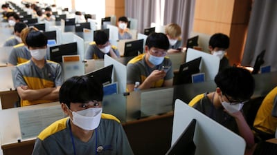 South Korean young men wear masks to protect against the new coronavirus as they take part in a conscription examination for the national service in Seoul, South Korea. Reuters