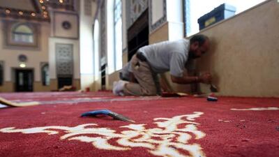 Workers carpet the floor at Al Farooq mosque in Al Safa area in Dubai.