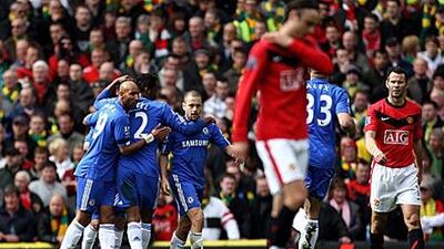 Cole, centre, is congratulated by Chelsea teammates after scoring the opener yesterday.