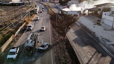 Smoke billows from a lorry set alight in the violence. Haulage companies have called on drivers to return to depots. AFP