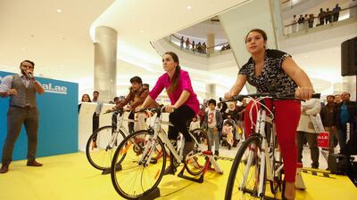 Shoppers are invited to cycle on stationary bikes and compete to burn the most calories.