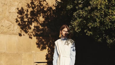 Dress, Dh23,714; shirt (worn underneath), Dh2,252; shoes, Dh2,027; and earring, Dh2,416, all from Givenchy. Socks, stylist’s own