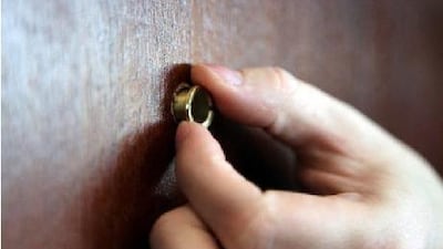 A step by step of how to install a peep hole in a door.