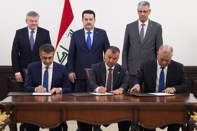 Iraq's Prime Minister Mohammed Shia al-Sudani (back-C) attends the signing of the Kirkuk oilfield development contract with BP in the presence of Iraq's Oil Minister Hayan Abdul-Ghani (R) and BP's chief executive Murray Auchincloss in Baghdad. AFP