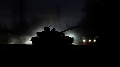A tank drives along a street in the city of Donetsk. Reuters